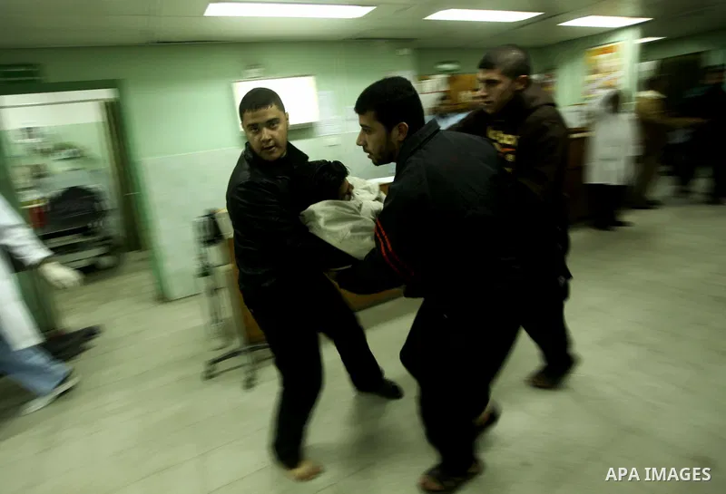A wounded Palestinian receives medical care at a hospital in northern Gaza Strip, after being injured during protests on Land Day close to the border with Israel in the northern Gaza Strip Friday, March 30, 2012. Israeli...