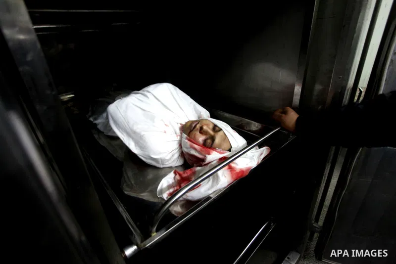Palestinians mourner for Mahmud Zakut during his funeral in Beit Lahia, north of the Gaza strip, on March 30, 2012. Israeli troops shot dead 20-year-old Zakut in Beit Hanun near the border fence with Israel, north of Gaz...