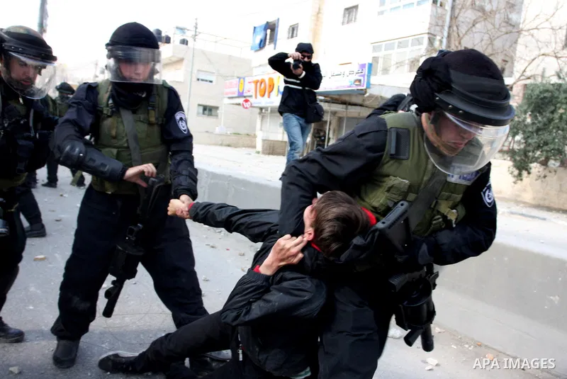 Foreign activists scuffle with Israeli security forces during clashes at a demonstration marking Land Day, at Qalandiya checkpoint, near the West Bank city of Ramallah March 30, 2012. Israeli security forces fired rubber...