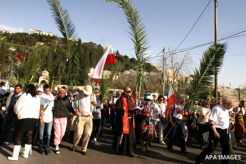 Christian pilgrims march during the traditional Palm Sunday procession from the Mount of Olives to Jerusalem's old city on April 1, 2012. Photo by Mahfouz Abu Turk