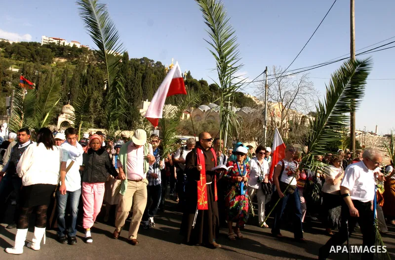 Christian pilgrims march during the traditional Palm Sunday procession from the Mount of Olives to Jerusalem's old city on April 1, 2012. Photo by Mahfouz Abu Turk