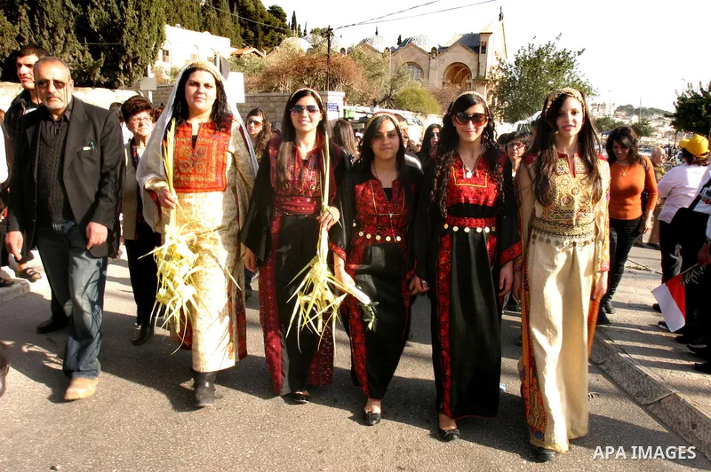 Christian pilgrims march during the traditional Palm Sunday procession from the Mount of Olives to Jerusalem's old city on April 1, 2012. Photo by Mahfouz Abu Turk