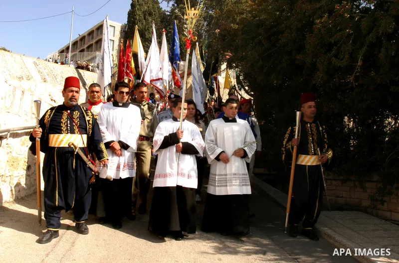 Christian pilgrims march during the traditional Palm Sunday procession from the Mount of Olives to Jerusalem's old city on April 1, 2012. Photo by Mahfouz Abu Turk
