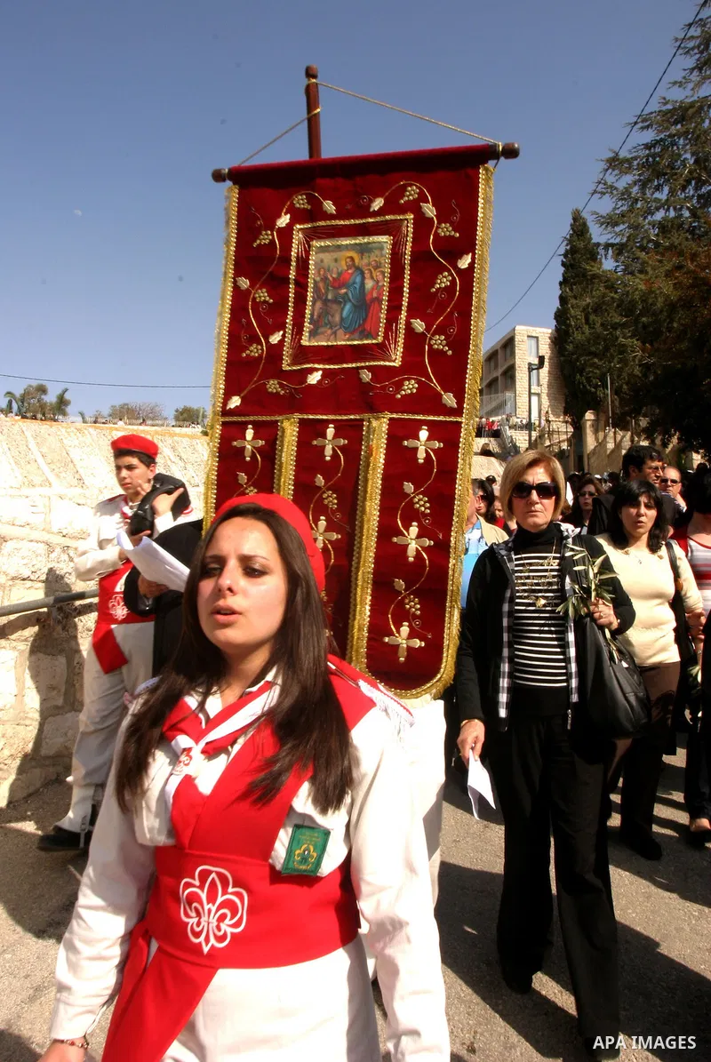 Christian pilgrims march during the traditional Palm Sunday procession from the Mount of Olives to Jerusalem's old city on April 1, 2012. Photo by Mahfouz Abu Turk