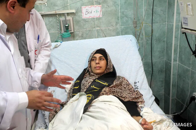 Hana Shalabi arrives to al-Shifa hospital in Gaza City, Sunday, April 1, 2012. Israel has released Shalabi, a 30-year-old Islamic Jihad supporter from the West Bank, and sent her to the Gaza Strip as part of a compromise...