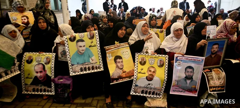 Palestinian relatives prisoners attend a protest calling for the release of their sons held in Israeli jails next the International Red Cross in Gaza City, Gaza Strip, on Apr. 02, 2012. Photo by Ali Jadallah
