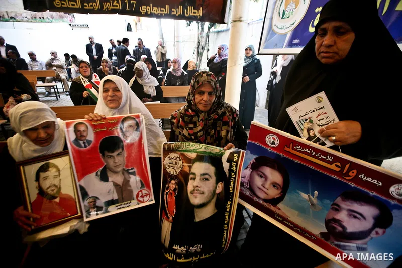 Palestinian relatives prisoners attend a protest calling for the release of their sons held in Israeli jails next the International Red Cross in Gaza City, Gaza Strip, on Apr. 02, 2012. Photo by Ali Jadallah