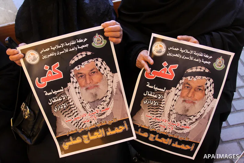 Palestinian relatives prisoners attend a protest calling for the release of their sons held in Israeli jails next the International Red Cross in Gaza City, Gaza Strip, on Apr. 02, 2012. Photo by Mohammed Asad