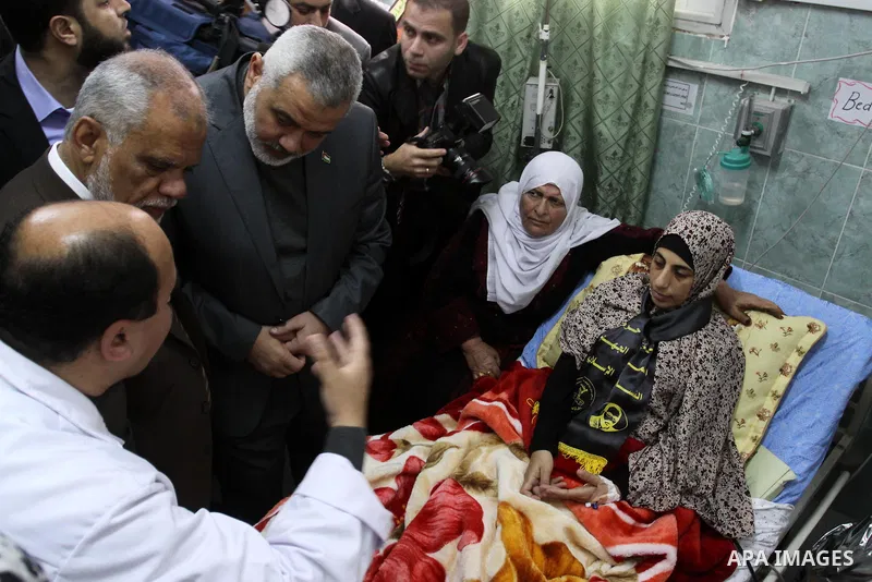 Palestinian Hamas premier in the Gaza Strip, Ismail Haniya visits Palestinian prisoner Hanaa Shalabi, who spent 43 days on hunger strike in an Israeli prison, in Al-Shefa hospital in Gaza City on April 2, 2012. Shalabi,...