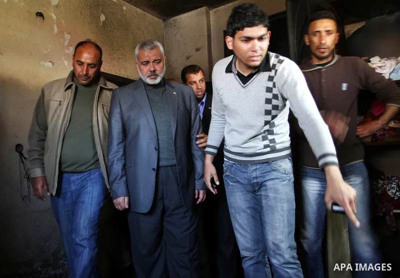 Palestinian prime minister in Gaza Strip, Ismail Haniya inspects the rubble in the room of the three children who were killed in a domestic fire during their funeral during their funeral procession in Deir al-Balah in th...