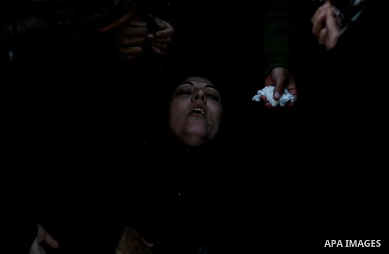 Palestinian women mourn during the funeral on April 2, 2012 in Rammun of Rashad Deeb, who was shot and injured by Israeli troops along with his two brothers in the early hours of March 27 in an incident in the West Bank...
