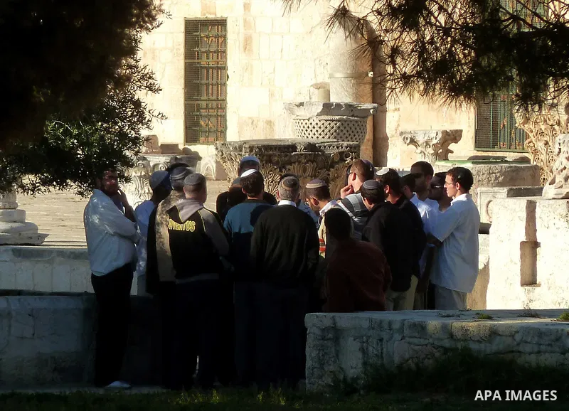 Jewish settlers stand in Jerusalem city.on Mar. 04, 2012. Photo by Mahfouz Abu Turk