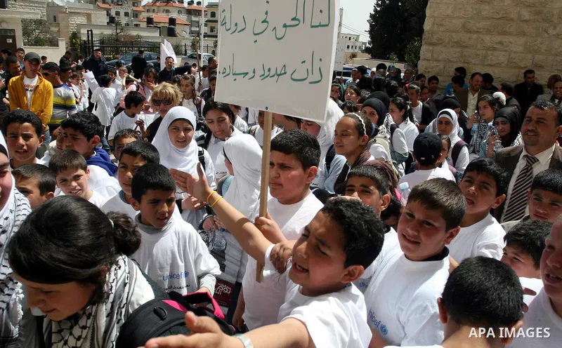 Palestinian children during a demonstration marking International Children's day, in front of the Palestinian Legislative Council in West Bank City of Ramallah, on April 5, 2012. Photo by Issam Rimawi
