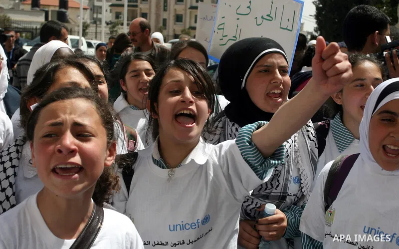 Palestinian children during a demonstration marking International Children's day, in front of the Palestinian Legislative Council in West Bank City of Ramallah, on April 5, 2012. Photo by Issam Rimawi