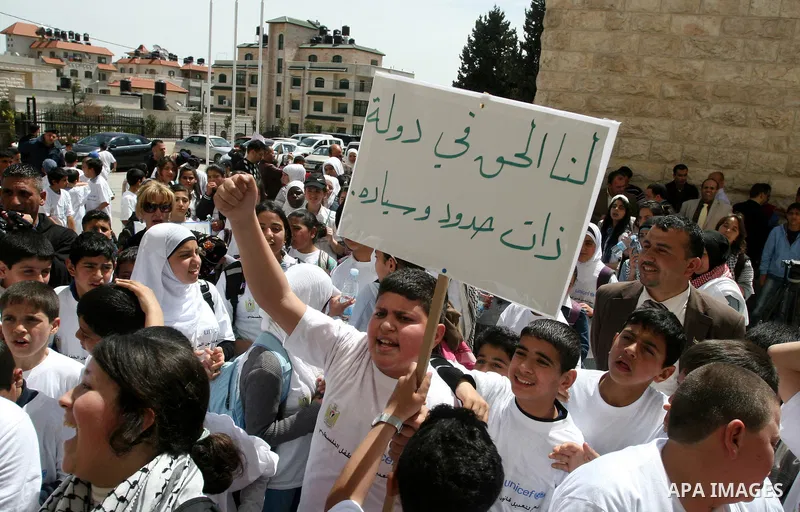 Palestinian children during a demonstration marking International Children's day, in front of the Palestinian Legislative Council in West Bank City of Ramallah, on April 5, 2012. Photo by Issam Rimawi