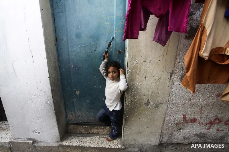 Palestinian children play in the streets of the Jabaliya refugee camp, northern Gaza Strip, 05 April 2012. The United Nations Relief and Works Agency (UNRWA) states that the Israeli blockade on Gaza has made life more di...