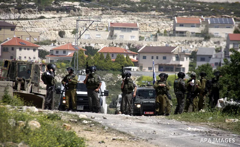 Palestinian protesters confront Israeli troops during a demonstration in the village Kafr Qaddum, close to the northern town of Nablus in the occupied Israeli West Bank on April 06, 2012. Photo by Wagdi Eshtayah