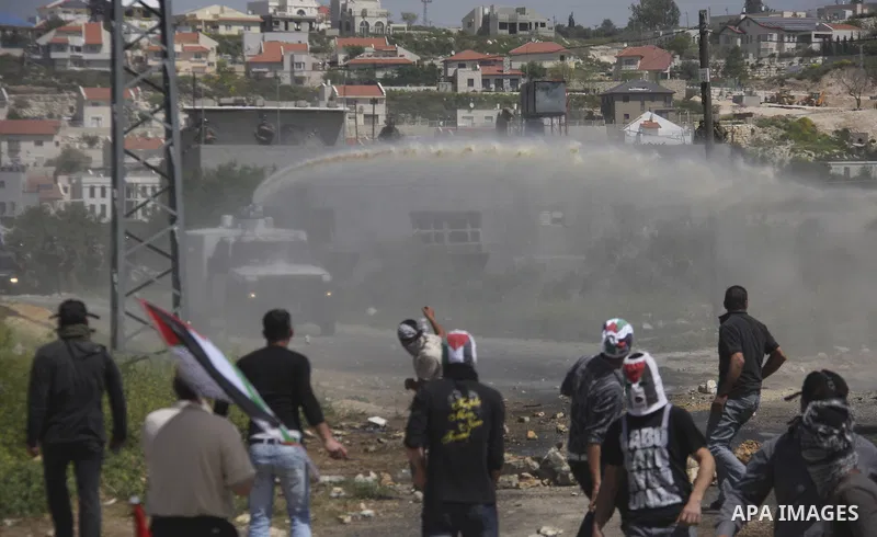 Palestinian protesters confront Israeli troops during a demonstration in the village Kafr Qaddum, close to the northern town of Nablus in the occupied Israeli West Bank on April 06, 2012. Photo by Wagdi Eshtayah