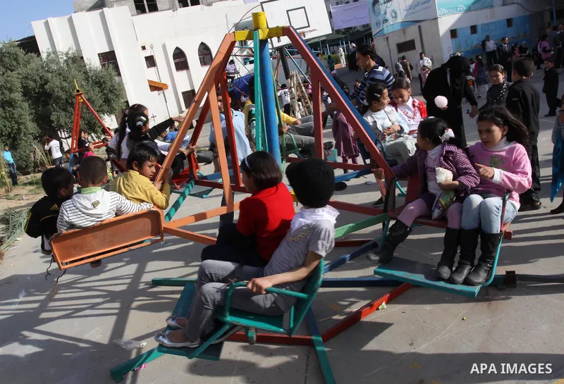 Palestinian children enjoy during celebrations marking Palestinian Children's Day in Gaza City in Gaza city, 06 April 2012. Photo by Mohammed Asad