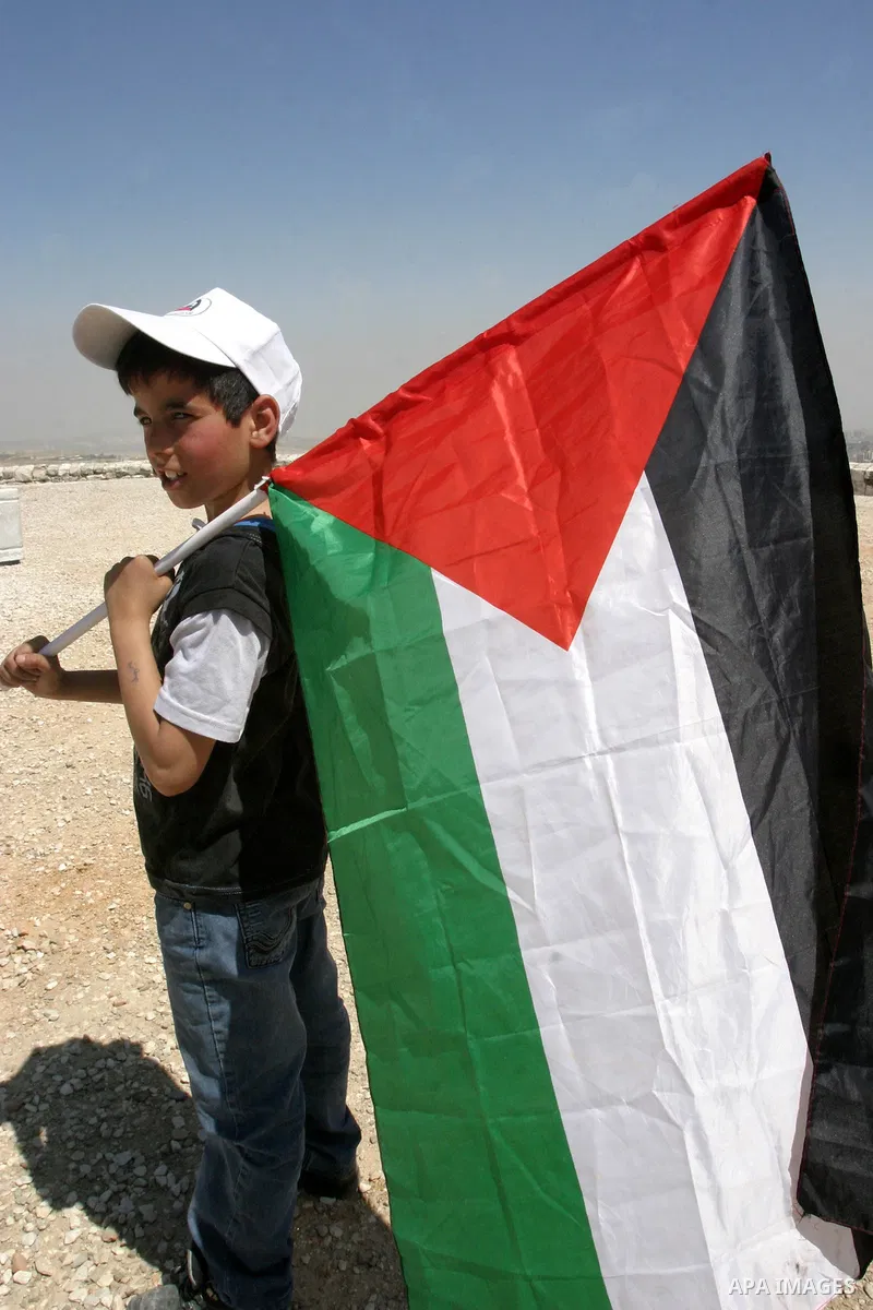 Palestinians pray on a street during Friday noon prayers on Apr. 06, 2012 in the East Jerusalem. Photo by Mahfouz Abu Turk