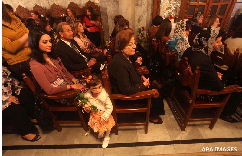 Palestinian Christian Catholics attend an Easter Vigil mass in Gaza City on April 8, 2012. Christians around the world mark the Holy Week of Easter to commemorate the crucifixion and resurrection of Jesus Christ. Photo b...