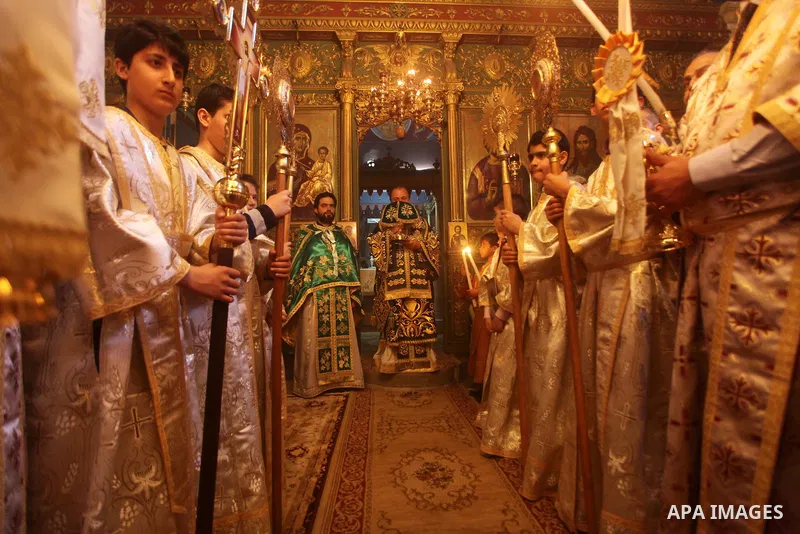 An Orthodox priest leads a Palm Sunday mass at the Saint Porfirios church in Gaza City April 8, 2012. Photo by Ashraf Amra