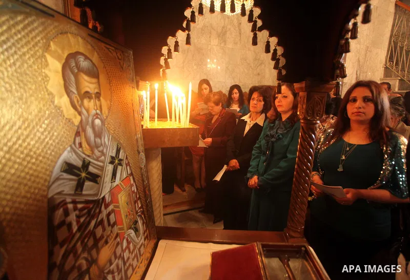 Palestinian Christian Catholics attend an Easter Vigil mass in Gaza City on April 8, 2012. Christians around the world mark the Holy Week of Easter to commemorate the crucifixion and resurrection of Jesus Christ. Photo b...
