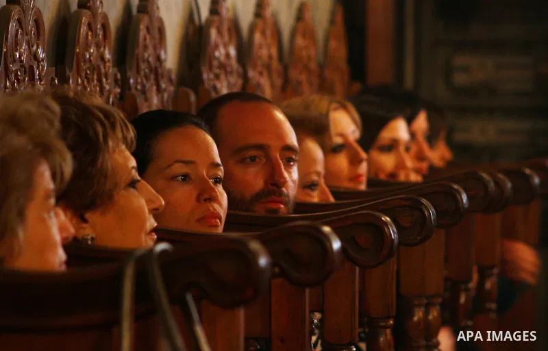 Palestinian Christian Catholics attend an Easter Vigil mass in Gaza City on April 8, 2012. Christians around the world mark the Holy Week of Easter to commemorate the crucifixion and resurrection of Jesus Christ. Photo b...