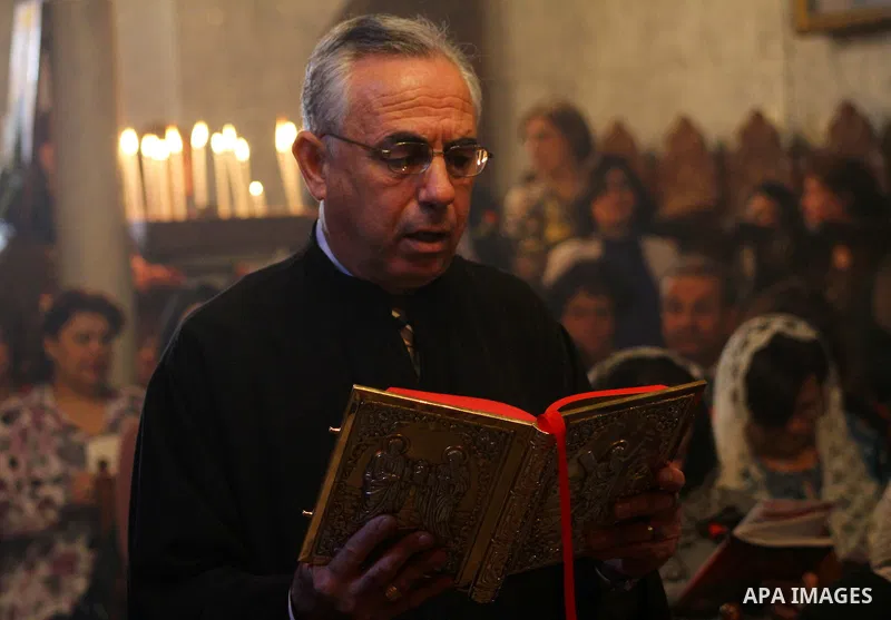 Palestinian Christian Catholics attend an Easter Vigil mass in Gaza City on April 8, 2012. Christians around the world mark the Holy Week of Easter to commemorate the crucifixion and resurrection of Jesus Christ. Photo b...