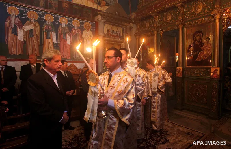 Palestinian Christian Catholics attend an Easter Vigil mass in Gaza City on April 8, 2012. Christians around the world mark the Holy Week of Easter to commemorate the crucifixion and resurrection of Jesus Christ. Photo b...