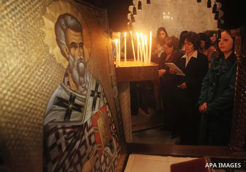 Palestinian Christian Catholics attend an Easter Vigil mass in Gaza City on April 8, 2012. Christians around the world mark the Holy Week of Easter to commemorate the crucifixion and resurrection of Jesus Christ. Photo b...