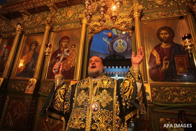 An Orthodox priest leads a Palm Sunday mass at the Saint Porfirios church in Gaza City April 8, 2012. Photo by Ashraf Amra