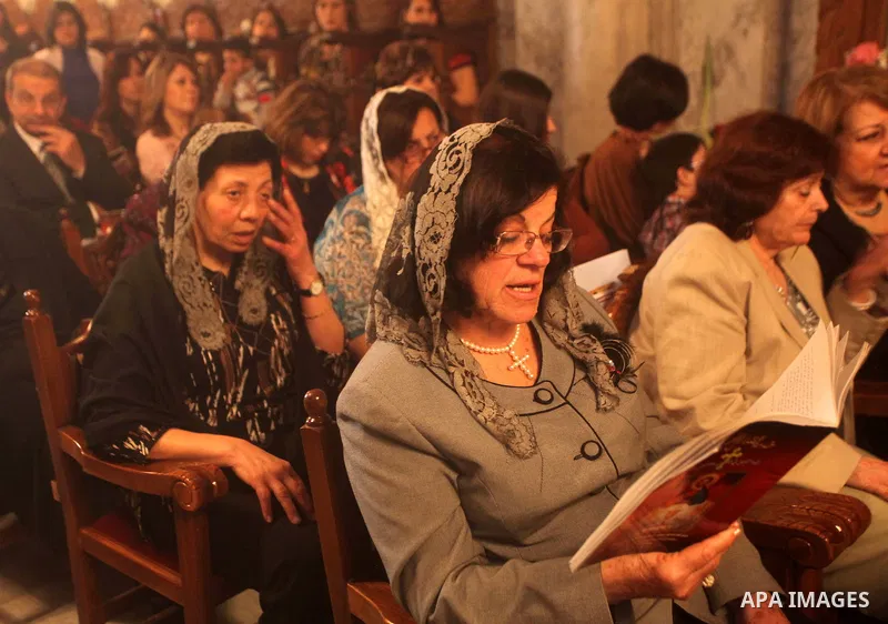 Palestinian Christian Catholics attend an Easter Vigil mass in Gaza City on April 8, 2012. Christians around the world mark the Holy Week of Easter to commemorate the crucifixion and resurrection of Jesus Christ. Photo b...