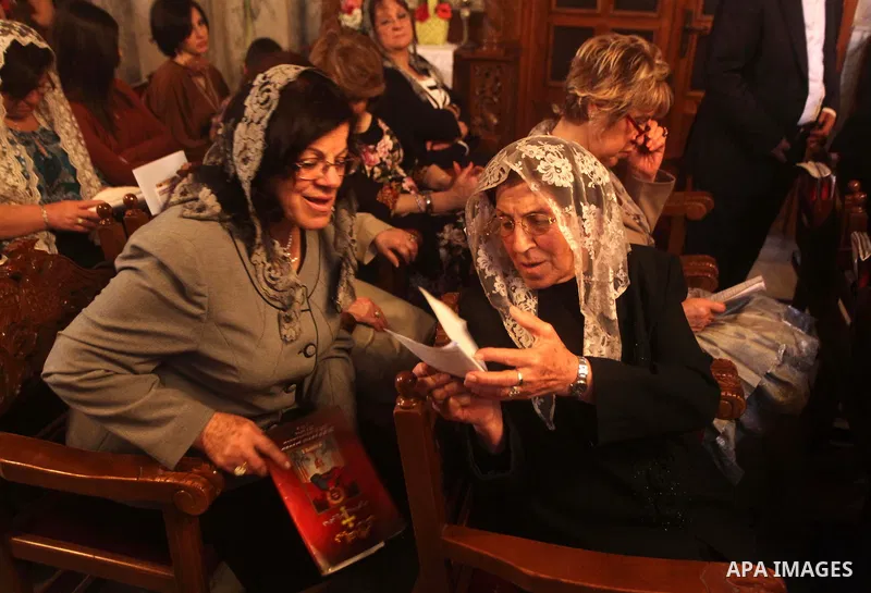 Palestinian Christian Catholics attend an Easter Vigil mass in Gaza City on April 8, 2012. Christians around the world mark the Holy Week of Easter to commemorate the crucifixion and resurrection of Jesus Christ. Photo b...