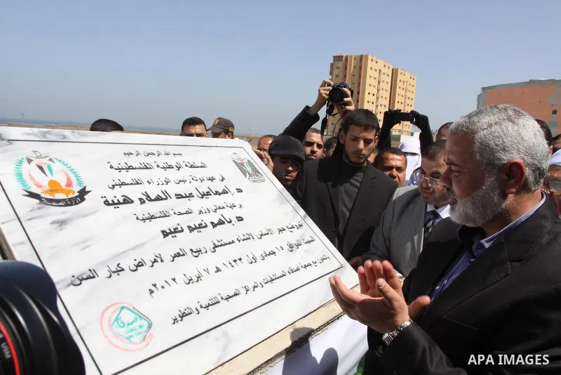 Palestinian Prime Minister in Gaza Strip, Ismail Haniya, lays Black Stone during the opening of the hospital for the elderly in Gaza City, on Apr. 08, 2012. Photo by Mohammed Asad