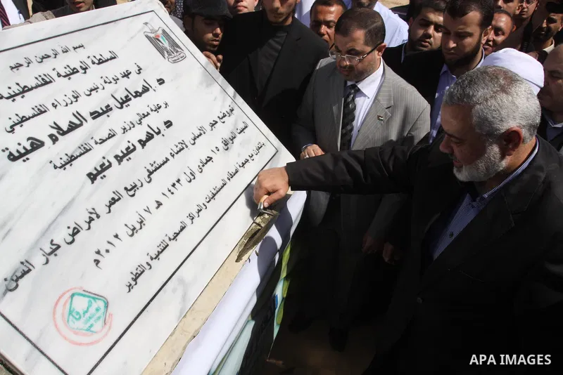 Palestinian Prime Minister in Gaza Strip, Ismail Haniya, lays Black Stone during the opening of the hospital for the elderly in Gaza City, on Apr. 08, 2012. Photo by Mohammed Asad