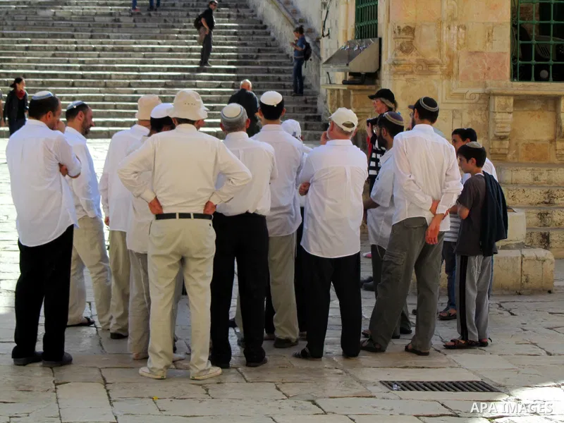 Jewish settlers stand in the yards of Al Aqsa Mosque in the old city of Jerusalem on Apr. 08, 2012. Photo by Mahfouz Abu Turk
