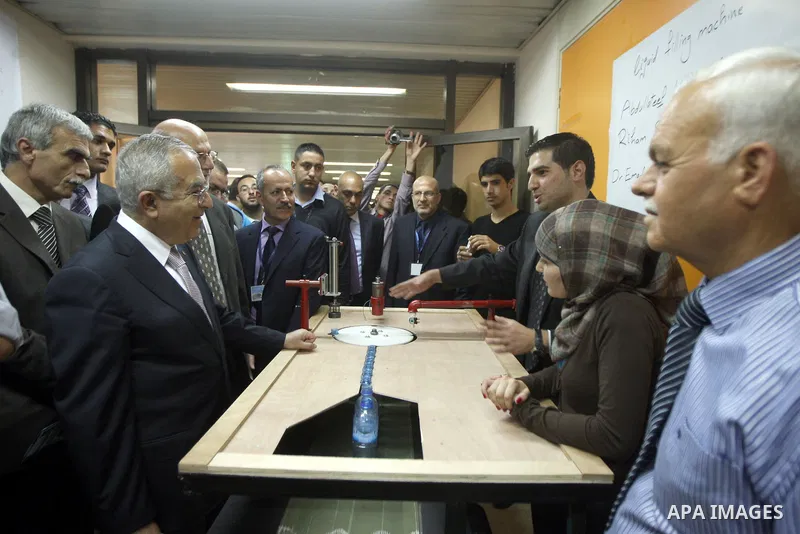 Palestinian Prime Minister, Salam Fayyad, attends the opining Engineering Day's ans Technological Day's in the Birzeit University in the West Bank city of Ramallah , on Apr. 09, 2012. Photo by Mustafa Abu Daya