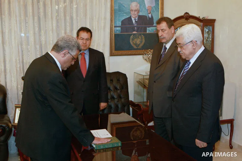 Palestinian President, Mahmoud Abbas (Abu Mazen), during adoption, Najah Abdul Rahman Mohammed Abdul Rahman, As Ambassador for Palestine State in Angola, in the West Bank city of Ramallah on April 09, 2012. Photo by Thae...