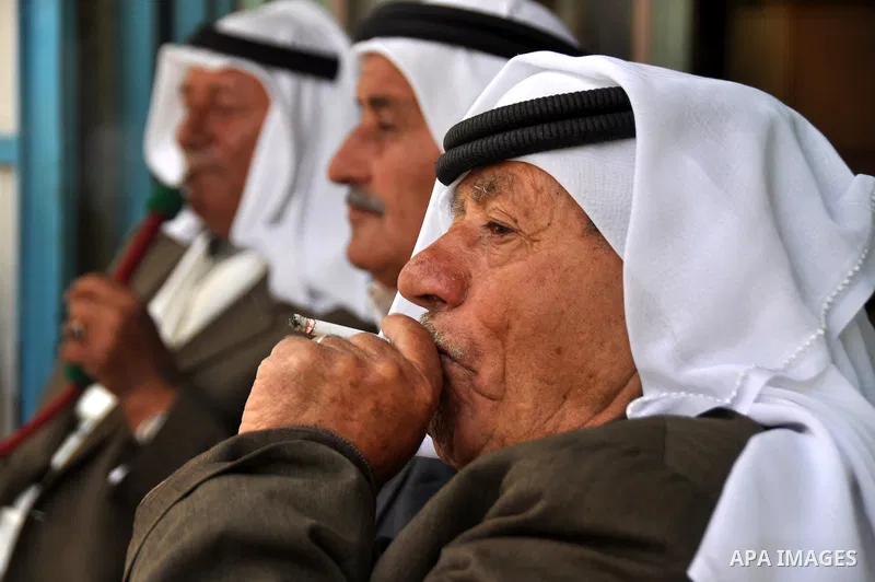 Palestinian elderly smoking waterpipes at cafe in the West Bank city of Nablus, on April, 10, 2012. Photo by Nedal Eshtayah