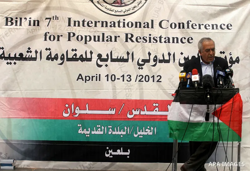 Palestinian Prime Minister Salam Fayyad, participates in the Sixth International Conference of the Bil'in popular resistance, in the village of Bil'in, in the West Bank city of Ramallah April 10, 2012. Photo by Issam Rim...