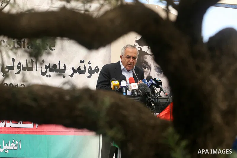 Palestinian Prime Minister Salam Fayyad, participates in the Sixth International Conference of the Bil'in popular resistance, in the village of Bil'in, in the West Bank city of Ramallah April 10, 2012. Photo by Issam Rim...