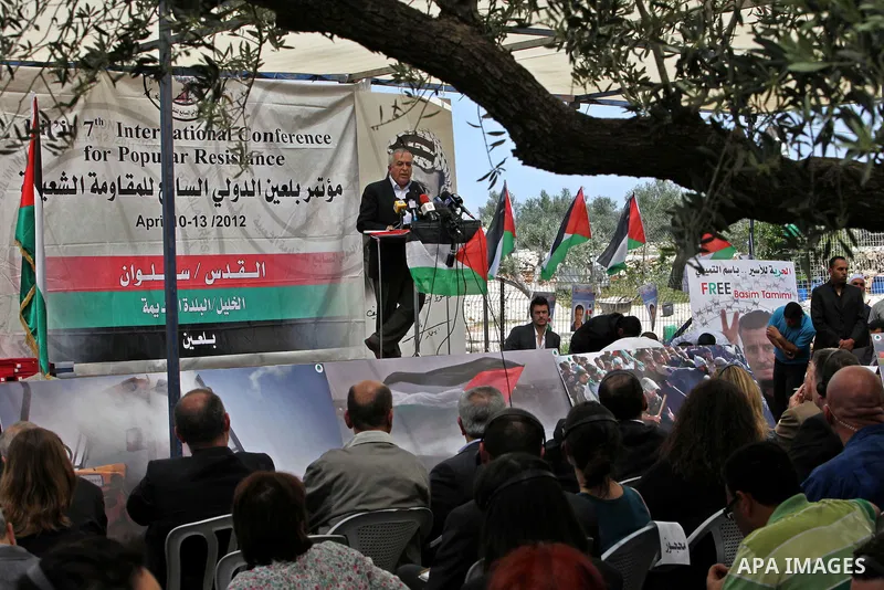 Palestinian Prime Minister Salam Fayyad, participates in the Sixth International Conference of the Bil'in popular resistance, in the village of Bil'in, in the West Bank city of Ramallah April 10, 2012. Photo by Mustafa A...