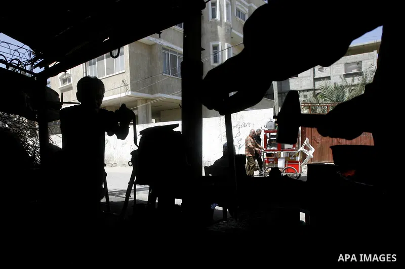 A Palestinian man works at a metal workshop in Rafah, southern Gaza Strip on April 10, 2012. Gaza has been in the grip of a severe power crisis for months now, with its sole electricity plant unable to function because o...