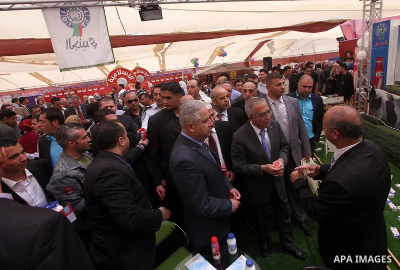 Palestinian Prime Minister Salam Fayyad attend Opening Ceremony of the food industry exhibition at the University of Hebron in west bank city of Hebron on April 11, 2012 Fayyad Inspect the first exhibition of agricultura...