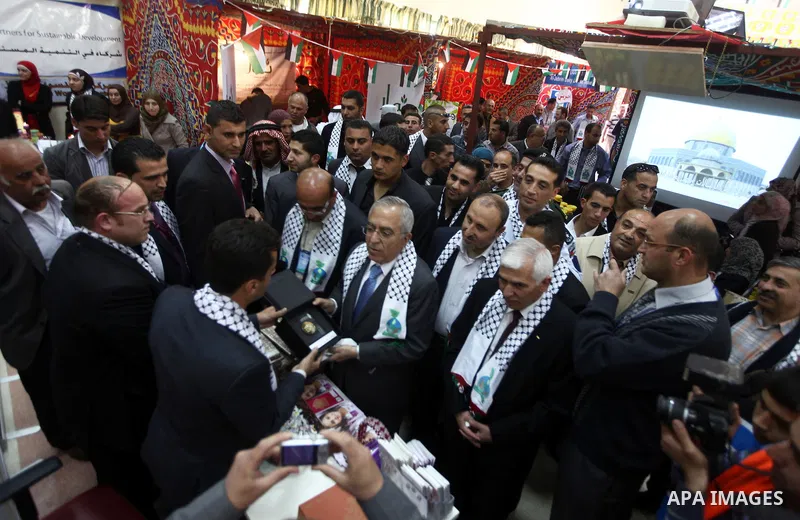 Palestinian Prime Minister Salam Fayyad attend Opening Ceremony of the food industry exhibition at the University of Hebron in west bank city of Hebron on April 11, 2012 Fayyad Inspect the first exhibition of agricultura...
