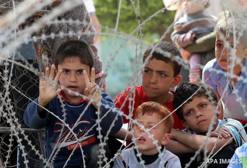 Palestinian boys attend a rally, calling for the release of Palestinian prisoners from Israeli jails, in Jabalya, in the northern Gaza Strip, April 13, 2012. Photo by Mohammed Asad