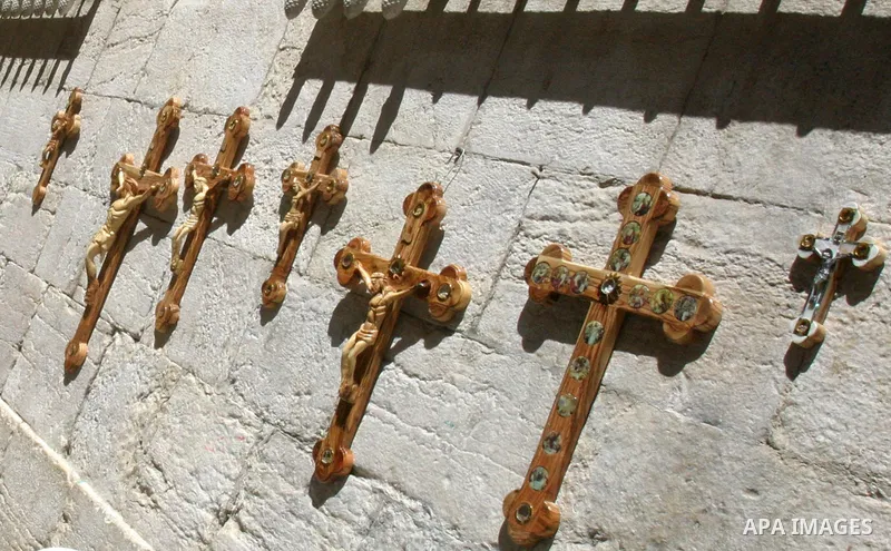 Orthodox Christian worshippers from Ethiopia carry a large cross during a Good Friday procession on the Via Dolorosa, retracing the route Jesus Christ walked to his crucifixion in Jerusalem, Israel, 13 April 2012. Thousa...
