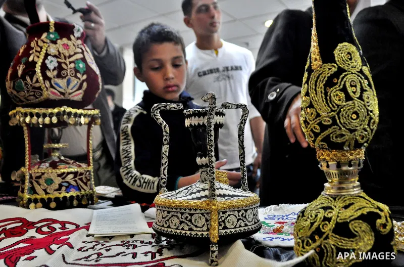 Palestinians participate in an exhibition in the first Palestinian Heritage Jerusalem, in the West Bank city of Nablus, April. 14, 2012. Photo by Nedal Shtieh.