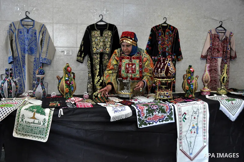 Palestinians participate in an exhibition in the first Palestinian Heritage Jerusalem, in the West Bank city of Nablus, April. 14, 2012. Photo by Nedal Shtieh.